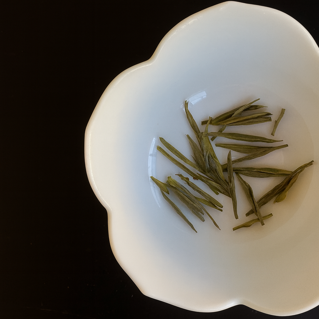 Anji Bai Cha leaves in a white bowl
